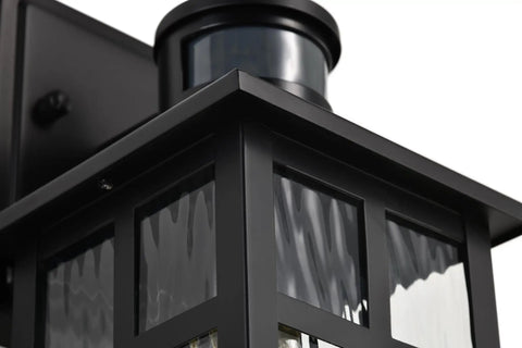 Built Different Matte Black Outdoor Wall Lights With Dusk To Dawn Motion Sensor And Water Glass Shade showing close-up of the geometric zinc body.