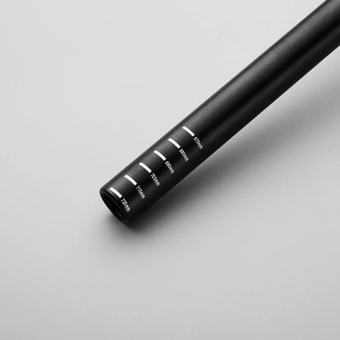 Close-up of Smpl Mountain Bike Handlebar 31.8mm Diameter 50mm Rise 720mm Width Aluminum Alloy Black, showing measurement markings.