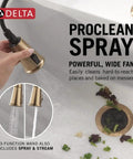 Modern Single Hole Kitchen Faucet With Slick Pull Down Sprayer Brushed Gold Finish showing ProClean spray wand in action over sink.