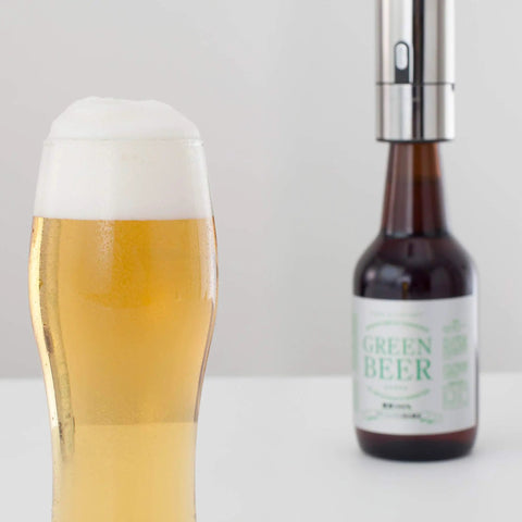 No Brainer Push Button Beer Foam Maker Creates Thick Frosty Heads Fast For Craft Ales And Cold Lagers in use with a glass of beer.