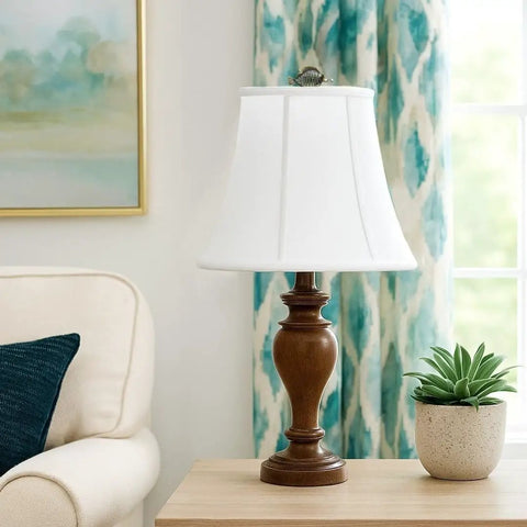Modified Bell Lampshade In Linen White, 10.5 X 17 X 13.5 Inches on wooden lamp in a modern living room with blue decor