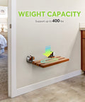 20-Inch Teak Folding Shower Seat Bench With Wall Mount displayed in a bathroom, emphasizing 400 lb support capacity.