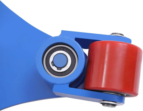 Close-up of heavy duty machinery transport skate with blue frame and red polyurethane caster, designed for smooth gliding operation.