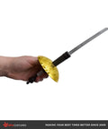 Cosplay Ready 25 Inch Plastic Fencing Foil Sword with gold guard, lightweight silver and black knight rapier prop in hand.