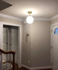 Mid Century Modern Ceiling Light Fixture With Milk Glass Shade And Matte Gold Finish Semi Flush Mount in hallway