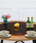 360 Degree Heavy Duty Lazy Susan Turntable For Dining Tables Tempered Glass Swivel Serving Tray on wooden table with dishes.