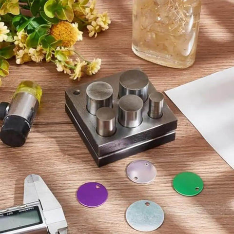 5 Piece Disc Cutter Set For Metal Jewelry Making With Round Punch Sizes 1/2, 5/8, 3/4, 7/8, And 1 Inch displayed on a table