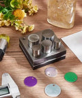 Disc Cutter Set For Jewelry Making 5 Piece Round Punch Tool Kit With Half Inch To One Inch Sizes on wooden table with tools and flowers