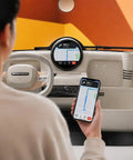 Interior view of Premium Two Seater Electric Golf Cart with smart cabin features and navigation on smartphone.