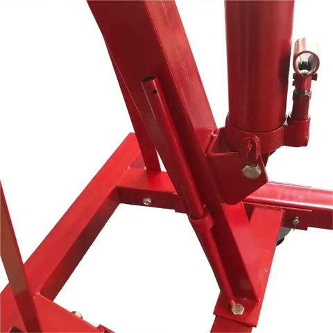 Detail view of Top Shelf Folding Hydraulic Engine Hoist With Telescopic Boom 2 Ton Capacity Muscle Power Motor Crane base structure.