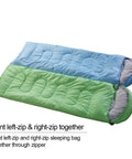 Green and blue sleeping bags joined, demonstrating zipper connection for 3-4 Season Sleeping Bag For Adults And Kids, Lightweight Camping Gear with Compression Sack, 87 X 29.5 Inches, 32F Temperature Rating For Warm Yet Cool Nights, Roll Control Design For Easy Packing, Dark Grey.