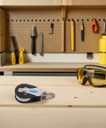 Stainless Steel Nylon Single Pulley Block 209kg Bearing Capacity for marine rigging on a workbench with tools and goggles