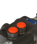 Close-up of single spool hydraulic control valve with red caps, showing durable cast iron construction and precise engineering for heavy-duty use.