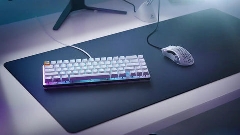 Solid Flex Compact Mechanical Gaming Keyboard With Heavy Aluminum Build Smooth Fox Switches Bright Per Key Rgb Full Nkro Support Uk Qwerty Mapping Sleek White Shell For Pro Setups on a gaming desk.
