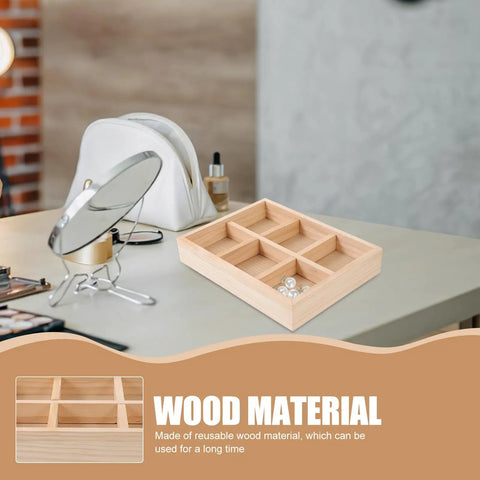 Slick Pine Wood Jewelry Organizer Tray with six compartments on a desk, ideal for rings and bracelets storage.