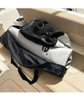 Inflatable Boat Fender For Docking And Raft Ups 42 Inch By 24 Inch Heavy Duty Military Grade Material in carry bag on boat seat.