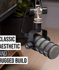 PodMic Cardioid Dynamic Broadcast Microphone With XLR Output Requires An Audio Interface For Studio Podcasts And Live Streaming Not USB Plug In Ideal For Rich Warm Voice And Reliable Crisp Dialogue On Air, close-up angle showing rugged build.