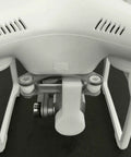 Close-up of DJI Phantom 3 drone showing Camera Lens Cap Cover for gimbal protection, highlighting durable design and fit.