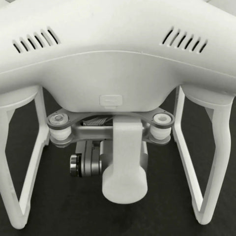 Close-up of DJI Phantom 3 drone showing Camera Lens Cap Cover for gimbal protection, highlighting durable design and fit.