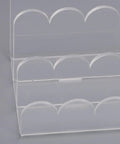 Close-up of Acrylic Mail Sorter With Three Slots For Letters Envelopes Bills And Small Office Supplies A Clear Wavy Desk Organizer