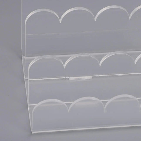 Close-up of Acrylic Mail Sorter With Three Slots For Letters Envelopes Bills And Small Office Supplies A Clear Wavy Desk Organizer