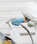 Close-up of Heavy Duty Pneumatic Undercoating Spray Gun With 33 Oz Suction Feed Cup for truck bed liner application.