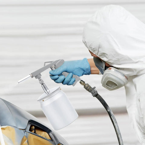 Close-up of Heavy Duty Pneumatic Undercoating Spray Gun With 33 Oz Suction Feed Cup for truck bed liner application.
