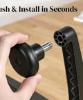 Close-up of hand installing a black bell glide, part of Set Of 5 Premium Bell Glides For Office Chair Caster Replacement Convert Rolling Casters To Stationary Feet Universal Fit For Desk Chairs Stop That Wobble And Stay Steady.