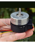 24H Runtime Brushless Servo Motor DC 12V With Built In Drive PWM Speed Regulation 100 Line Encoder held in hand