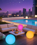 Cordless 16 Inch LED Glowing Ball Light With Remote RGB Color Changing Waterproof Glow Ball on patio by pool at night