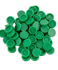 Pile of small green circular felt pads for furniture protection or craft projects