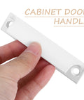 Hand holding 2-Piece Aluminum Cabinet Handles In White Finish For Kitchen Cupboards And Dresser Hardware, close-up view