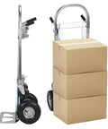 Heavy Duty 2 In 1 Utility Dolly Cart Convertible Folding Trolley With 800 Lb Capacity next to stacked cardboard boxes.