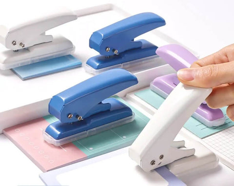 Assorted single hole punches including purple, showing different colors; Rugged Heavy Duty Single Hole Punch For Papers And Crafts 40 Sheets Capacity