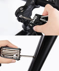 Using the 14 In 1 Bike Repair Tool Kit With Under Seat Saddle Bag for Road Mountain and Commuter Bikes to adjust bike components.