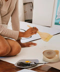Woman painting with Water Activated Kraft Paper Tape Writable Waterproof Packing Tape 3.6 Cm Wide Eco Friendly 2 Rolls nearby