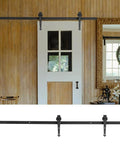 6-Foot Sliding Barn Door Roller Track Kit with Carbon Steel Hardware and POM Rollers installed on a door in a home interior