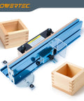 Adjustable Box Joints Jig For Table Saws And Router Tables with MDF Sub Fence and safety blade guard shown with wooden boxes