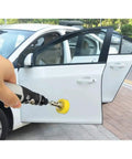 Hand using a rotary tool with Grab This Killer 6 Pcs One Inch Sanding Pad Set With Super Grip Hook And Loop Backing Plus Dust Vent Holes For Quick Swaps And Clean Views On Any DIY Or Pro Project With Versatile Shank Sizes on a car door.