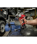 Heavy Duty Half Inch Chuck Cordless Drill Driver With Smooth Operator Grip And Kickass Torque For Tight Squeeze Job Sites in use on a workbench.