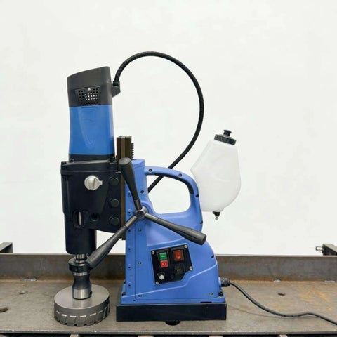 Beefy Magnetic Drill Press With Variable Speed, Portable Core Drilling Machine for Steel Plates and Hollow Sections, 1580W, Industrial and Home Use, Handheld, Built Tough for Pros and DIYers on work surface.
