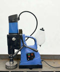 Heavy Duty Portable Magnetic Drill Press With Smooth Variable Speed Control Built Different To Crush Steel Plates And Handle All Your Reaming Tapping Workshop Projects on a workshop table.
