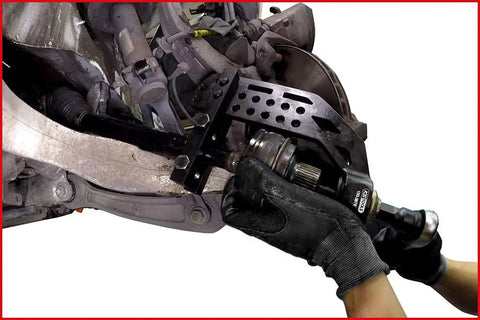Universal Driveshaft Puller Set For Cars And Trucks Pro Grade being used on a car drivetrain