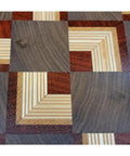 Close-up of end-grain wood pattern on a Solid End Grain 12 Inch Wooden Lazy Susan Round Kitchen Centerpiece For Spices Condiments And Everyday Essentials A Dope Rotating Organizer For Dining Table Pantry Cabinets And Home Decor.