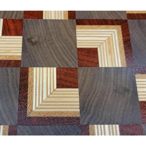 Close-up of end-grain wood pattern on a Solid End Grain 12 Inch Wooden Lazy Susan Round Kitchen Centerpiece For Spices Condiments And Everyday Essentials A Dope Rotating Organizer For Dining Table Pantry Cabinets And Home Decor.