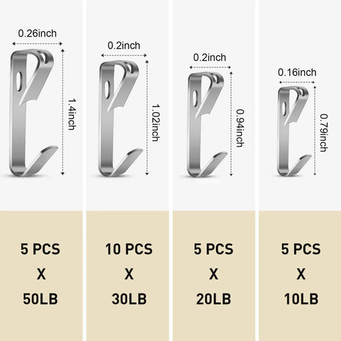 Four metal hooks of the Heavy Duty Picture Hanging Kit With 50 Pcs Hooks And Nails, different sizes supporting 10 to 50 lbs