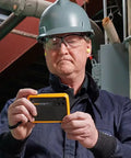 Technician using PTi120 Pocket Thermal Imager for quick infrared inspections and temperature scans on electrical panel.