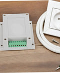 Tough Yet Compact Weatherproof Junction Box For Industrial Use with ABS plastic enclosure and screws on a wooden surface