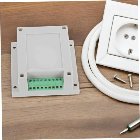 Tough Yet Compact Weatherproof Junction Box For Industrial Use with ABS plastic enclosure and screws on a wooden surface