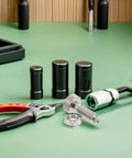 Precision Hand Operated Spring Loaded Locking Plunger Pin With M10 Thread And Knurled Stainless Steel Handle For Industrial Equipment And Robotic Joint Modules That Nails Positioning Down To 0.02mm Every Single Time on a workbench with pliers and tools.